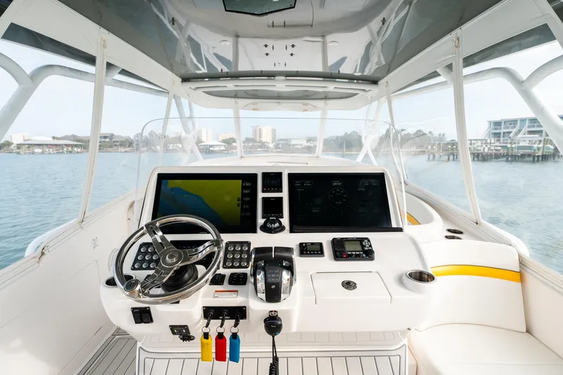 Slide: The Image of 2020 Intrepid 407 Cuddy helm with advanced navigation and control systems. - 58