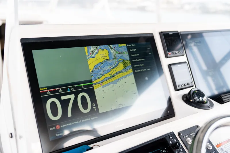 Slide: The Image of Navigation display on 2020 Intrepid 407 Cuddy boat, showing map and compass details. - 67
