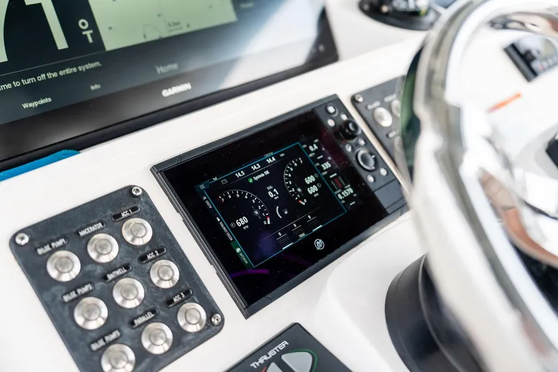 Slide: The Image of Dashboard of 2020 Intrepid 407 Cuddy boat with digital displays and controls. - 68