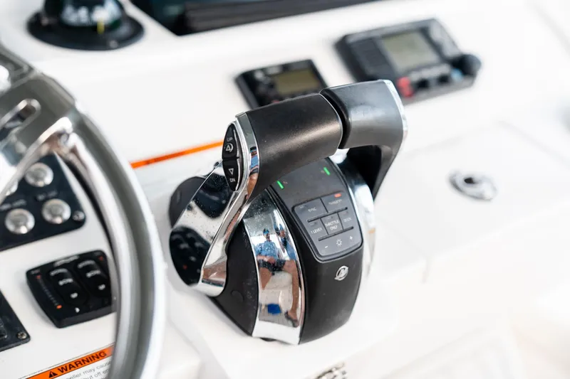 Slide: The Image of Close-up of 2020 Intrepid 407 Cuddy boat controls and steering wheel. - 69