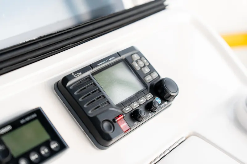 Slide: The Image of Close-up of marine radio equipment on 2020 Intrepid 407 Cuddy boat dashboard. - 71