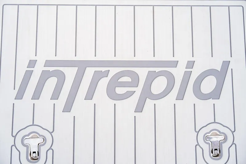 Slide: The Image of Intrepid 407 Cuddy 2020 logo on boat deck with two latches. - 74