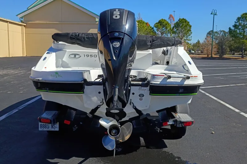 Slide: The Image of Rear view of a 2017 Tahoe 1950 boat with an outboard motor in a parking lot. - 4