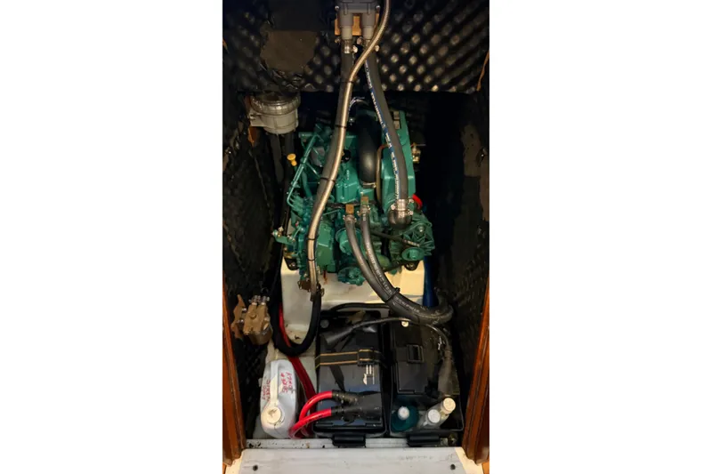 Slide: The Image of Engine compartment of a 2004 Beneteau First 36.7 sailboat, featuring a well-maintained motor. - 15