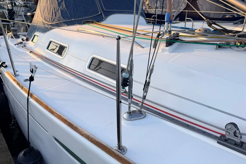 Slide: The Image of 2004 Beneteau First 36.7 sailboat deck with rigging and windows. - 19