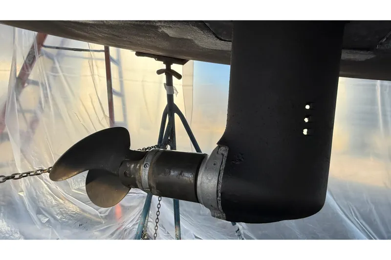 Slide: The Image of Propeller of 2004 Beneteau First 36.7 sailboat in dry dock, covered in protective plastic. - 29