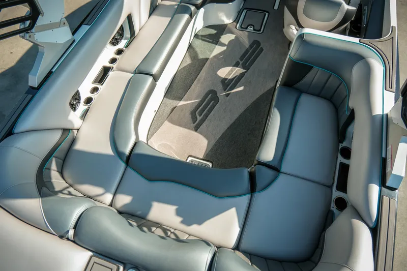 Slide: The Image of Interior of 2019 MB B52 23 Classic boat with luxurious seating and cup holders. - 13