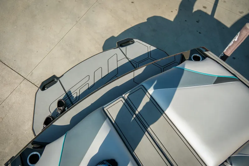 Slide: The Image of 2019 MB B52 23 Classic boat interior with sleek gray seating and cup holders. - 14