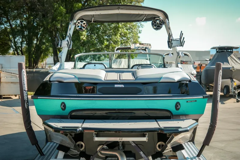 Slide: The Image of 2019 MB B52 23 Classic boat, teal and black, parked outdoors. - 8