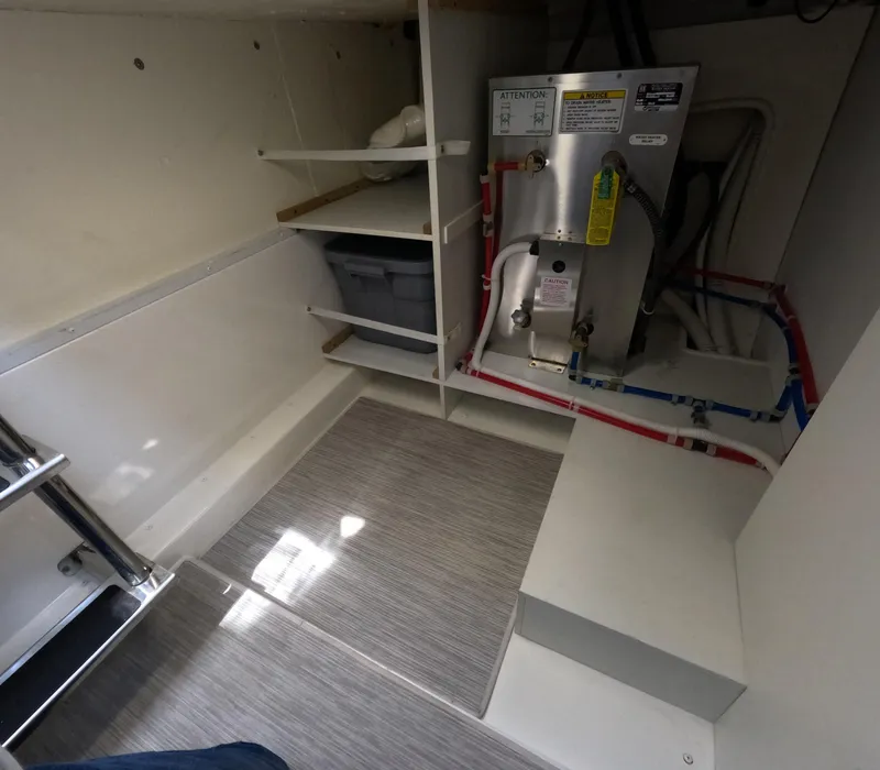 Slide: The Image of 2019 Carver C37 Coupe interior storage area with equipment and shelving. - 20