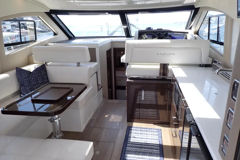 Slide: The Image of Luxurious interior of 2019 Carver C37 Coupe yacht with modern seating and elegant design. - 25