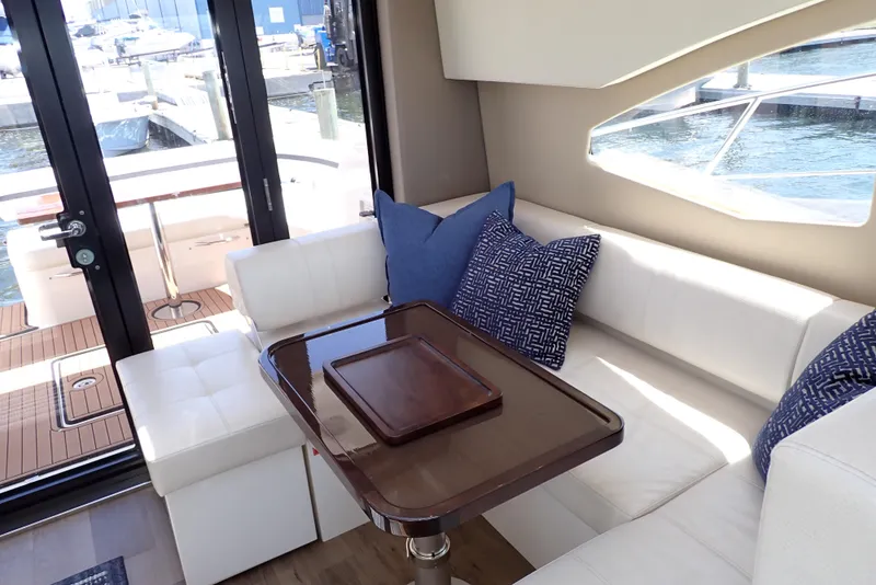 Slide: The Image of Luxurious interior of 2019 Carver C37 Coupe yacht with elegant seating and waterfront view. - 28