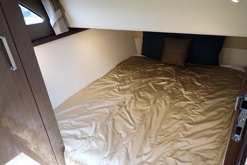 Slide: The Image of Interior cabin of 2019 Carver C37 Coupe with cozy bed and pillows. - 33