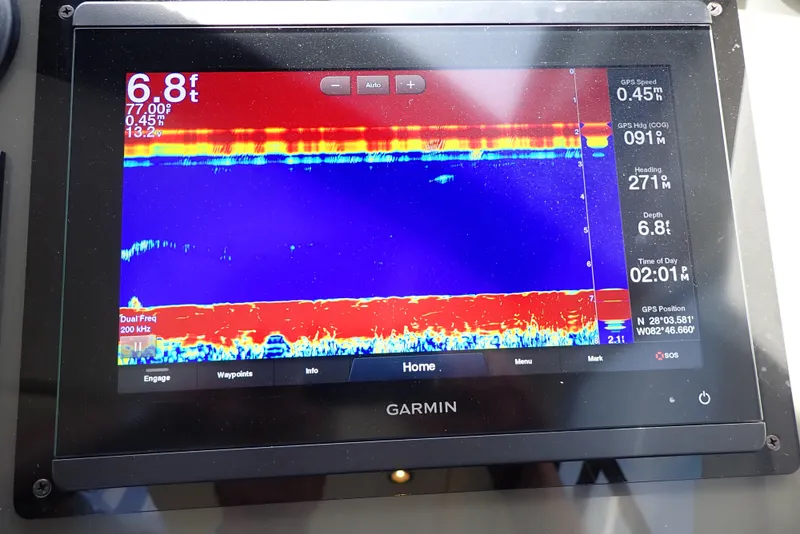 Slide: The Image of Garmin sonar display on 2019 Carver C37 Coupe, showing water depth and GPS data. - 48