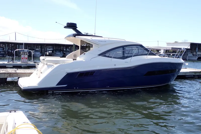 Slide: The Image of 2019 Carver C37 Coupe yacht docked at marina, featuring sleek design and modern amenities. - 110