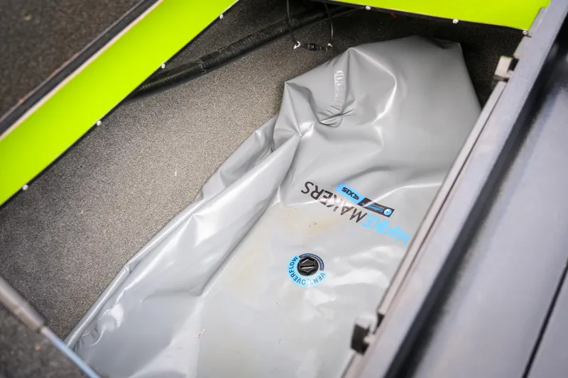 Slide: The Image of 2016 Axis A22 boat storage compartment with WakeMakers ballast bag. - 21