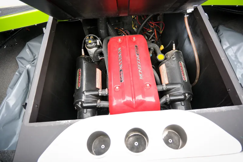 Slide: The Image of 2016 Axis A22 boat engine compartment with red Monsoon 350 engine cover. - 22