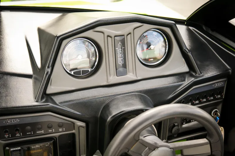 Slide: The Image of 2016 Axis A22 dashboard with gauges and controls, featuring a sleek design. - 24