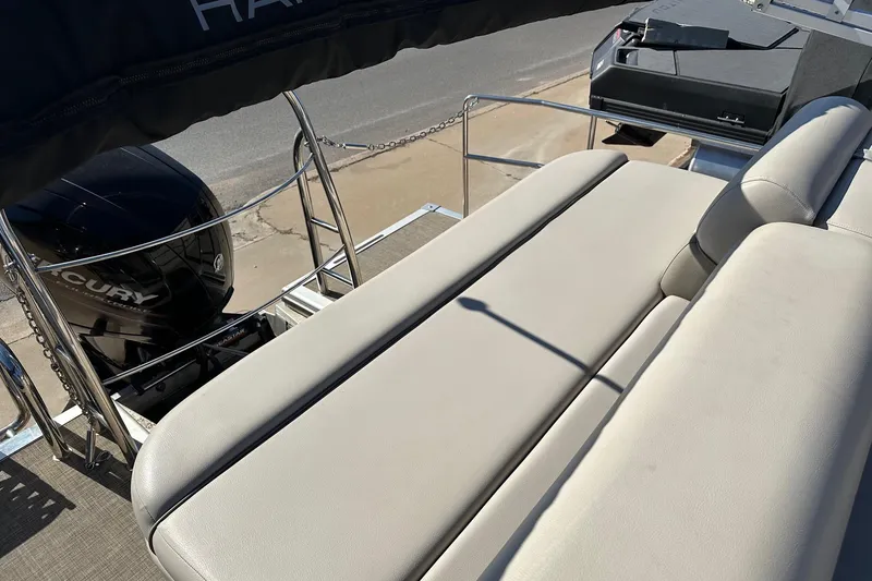 Slide: The Image of 2019 Harris Cruiser 230 boat with Mercury engine and comfortable seating. - 8