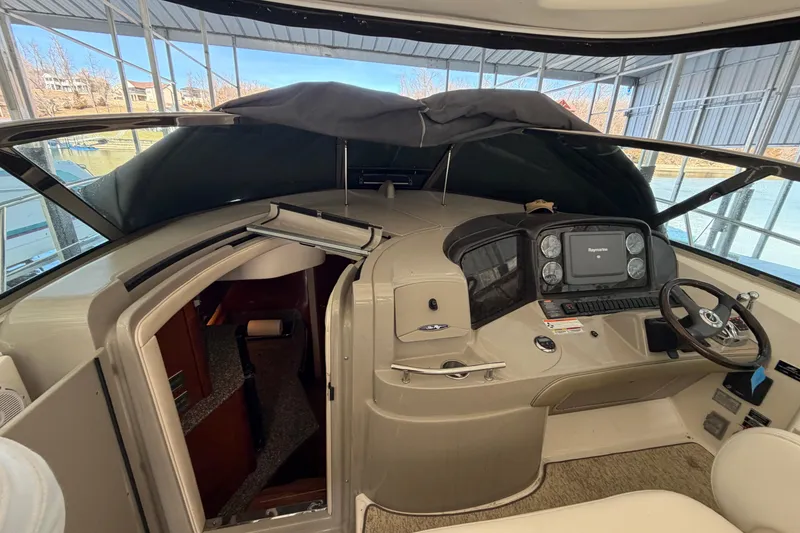 Slide: The Image of 2008 Sea Ray 38 Sundancer helm with navigation system and cabin entrance. - 14