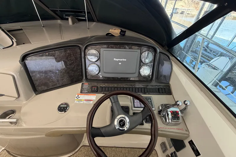 Slide: The Image of Helm of 2008 Sea Ray 38 Sundancer with Raymarine navigation system and controls. - 15