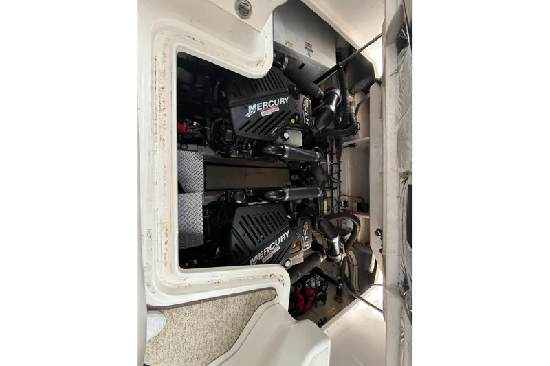 Slide: The Image of Engine compartment of a 2008 Sea Ray 38 Sundancer with twin Mercury engines. - 35