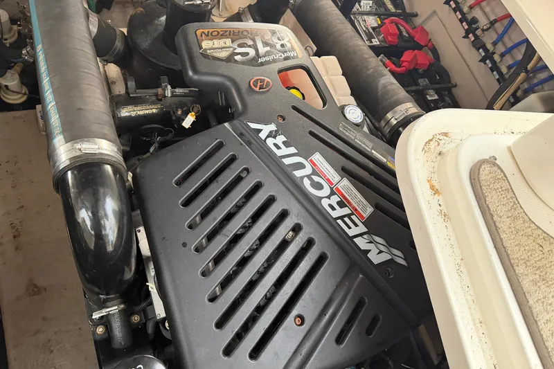 Slide: The Image of Engine compartment of a 2008 Sea Ray 38 Sundancer with Mercury components. - 38