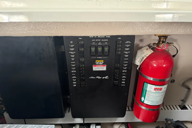Slide: The Image of Electrical panel and fire extinguisher on 2008 Sea Ray 38 Sundancer boat. - 40
