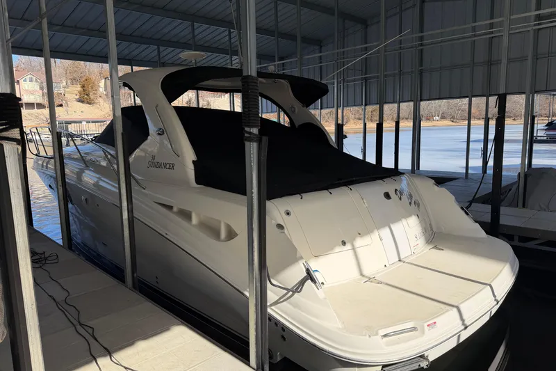 Slide: The Image of 2008 Sea Ray 38 Sundancer yacht docked in a covered marina. - 5