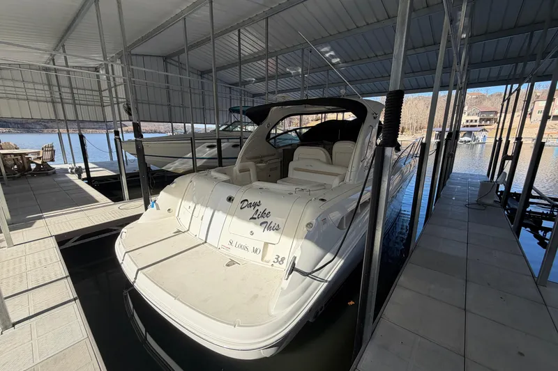 Slide: The Image of 2008 Sea Ray 38 Sundancer docked in a covered marina slip. - 6