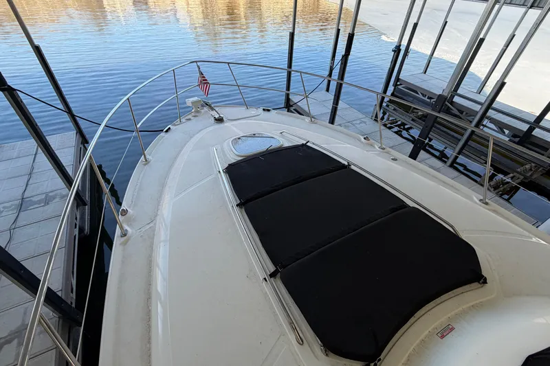 Slide: The Image of 2008 Sea Ray 38 Sundancer yacht docked, featuring spacious deck and sleek design. - 7