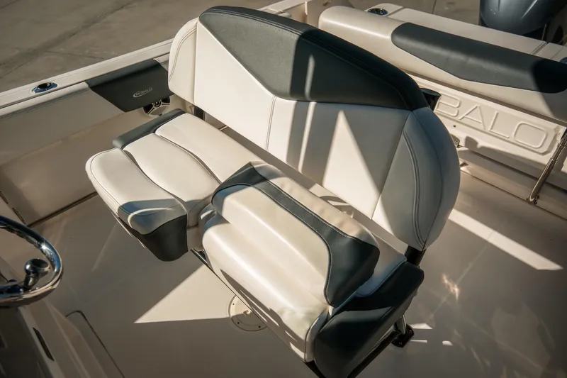 Slide: The Image of 2020 Robalo R242 Center Console boat seating, featuring stylish black and white upholstery. - 18