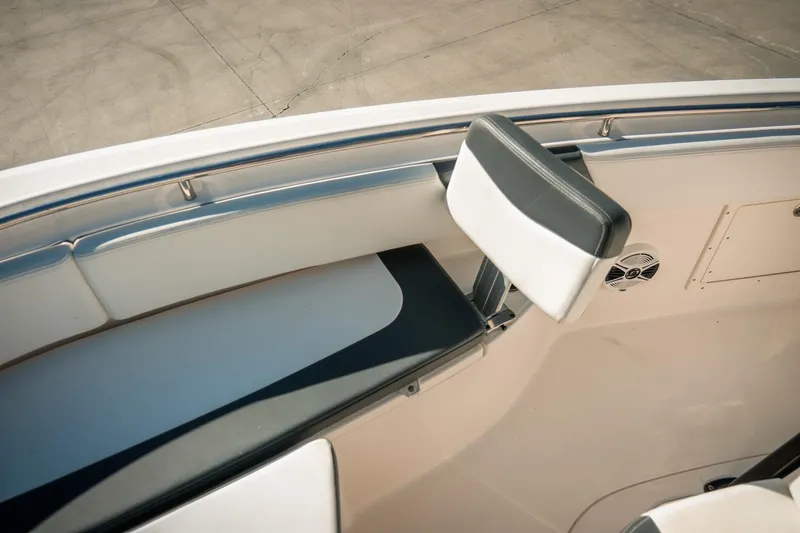 Slide: The Image of 2020 Robalo R242 Center Console boat interior with seating and speaker detail. - 21