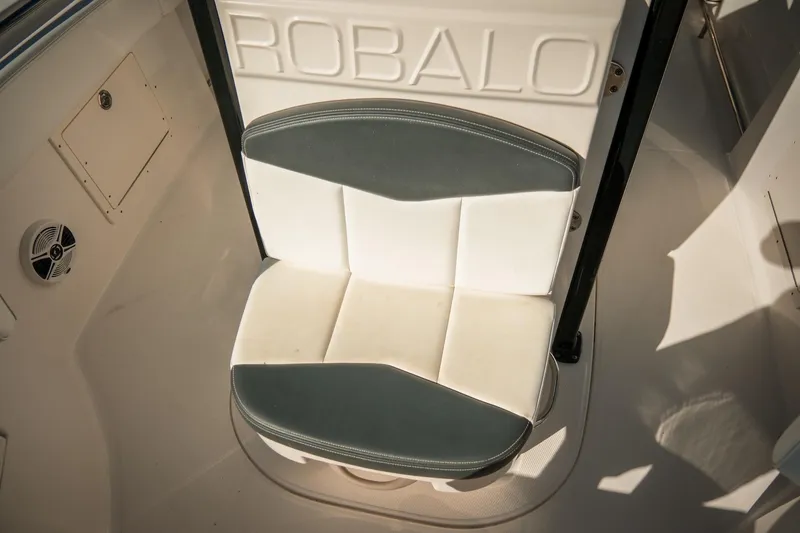 Slide: The Image of 2020 Robalo R242 Center Console boat seat, white and gray upholstery. - 23