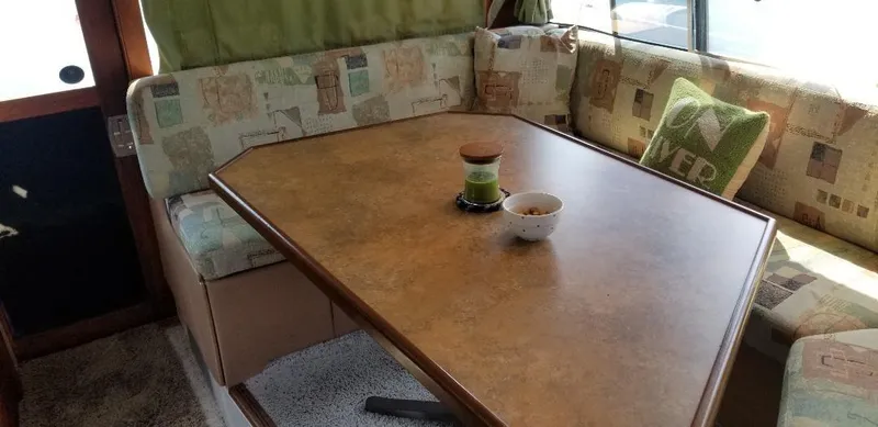 Slide: The Image of Interior of 1989 Bayliner 3888 Motoryacht with dining table and seating area. - 10