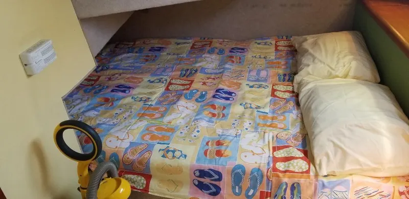 Slide: The Image of Bed in 1989 Bayliner 3888 Motoryacht with colorful bedding. - 19