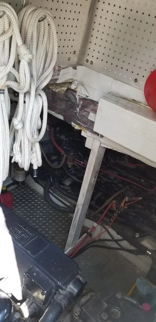 Slide: The Image of Engine room of 1989 Bayliner 3888 Motoryacht with ropes and cables. - 4