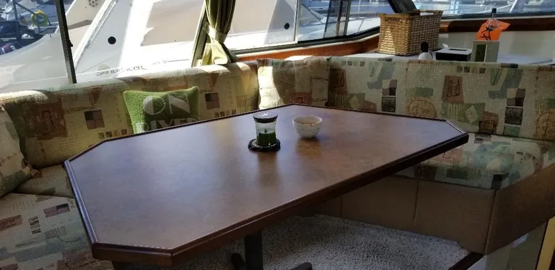 Slide: The Image of Interior of 1989 Bayliner 3888 Motoryacht with dining table and seating area. - 7