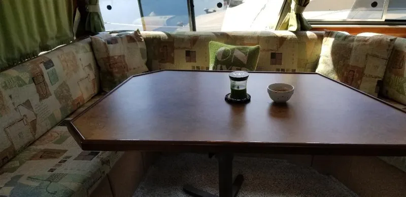 Slide: The Image of Interior of 1989 Bayliner 3888 Motoryacht with table and seating area. - 8