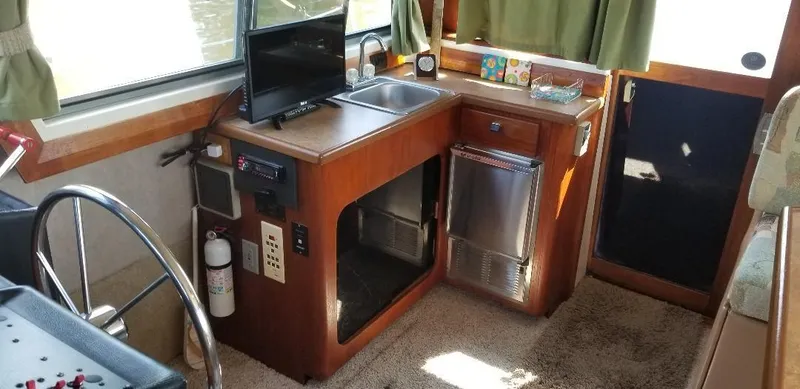 Slide: The Image of 1989 Bayliner 3888 Motoryacht interior with kitchenette. - 9