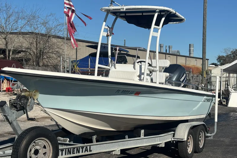 Slide: The Image of 2001 Key West 210 Bay Reef boat on trailer, parked outdoors. - 11