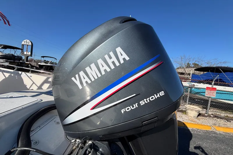 Slide: The Image of Yamaha four-stroke engine on 2001 Key West 210 Bay Reef boat, sunny day. - 16
