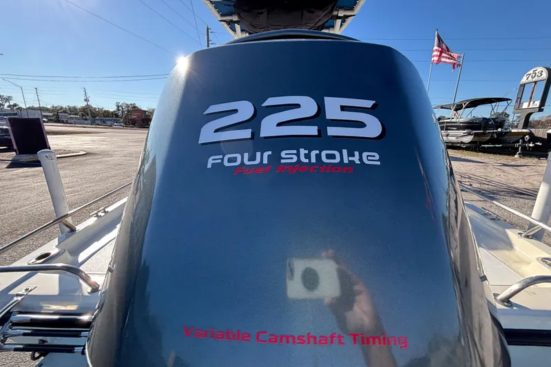 Slide: The Image of Outboard motor on 2001 Key West 210 Bay Reef, featuring 225 four-stroke fuel injection. - 19