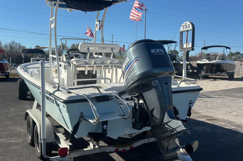 Slide: The Image of 2001 Key West 210 Bay Reef boat with Yamaha 225 engine on a trailer. - 2