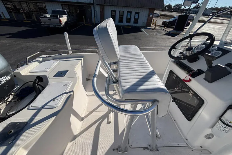 Slide: The Image of 2001 Key West 210 Bay Reef boat interior with steering console and seating. - 22