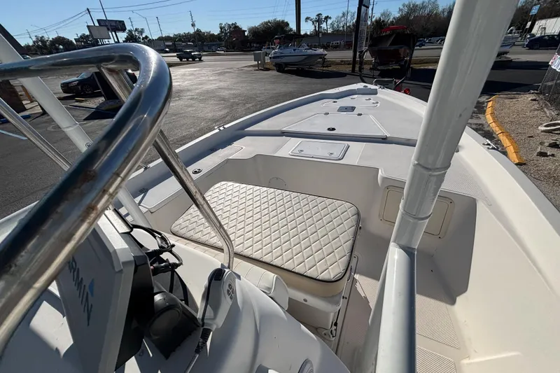 Slide: The Image of 2001 Key West 210 Bay Reef boat interior with seating and navigation equipment. - 24