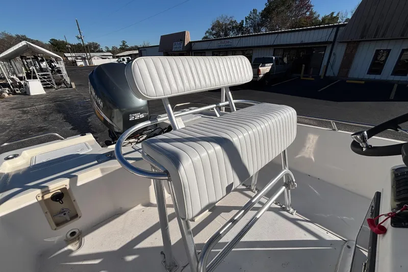 Slide: The Image of 2001 Key West 210 Bay Reef boat with Yamaha 225 engine, featuring white cushioned seating. - 26