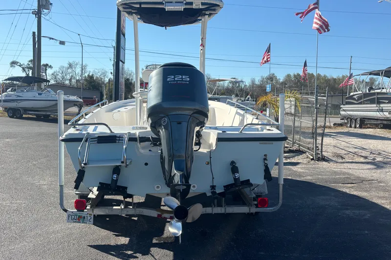 Slide: The Image of 2001 Key West 210 Bay Reef boat with 225 horsepower engine, displayed outdoors. - 3