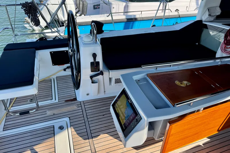 Slide: The Image of Cockpit of 2019 Beneteau Oceanis 41.1 sailboat with steering wheel and navigation equipment. - 18