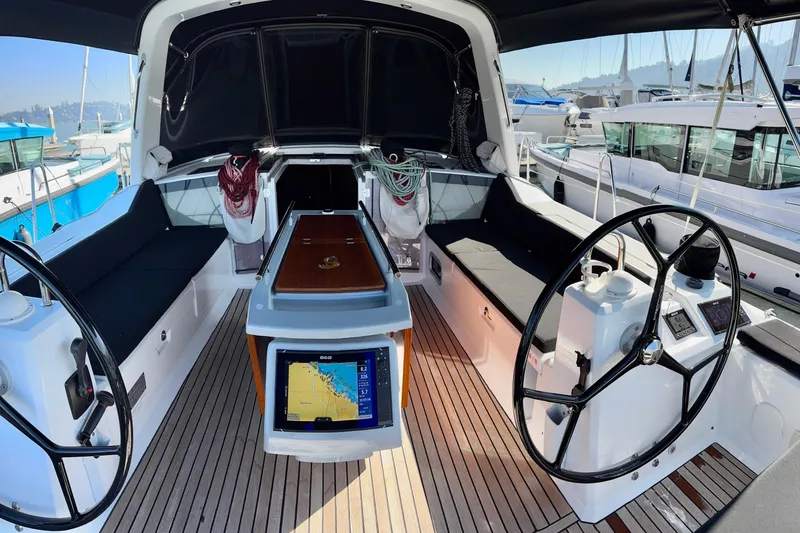 Slide: The Image of 2019 Beneteau Oceanis 41.1 yacht cockpit with dual steering wheels and navigation system. - 23